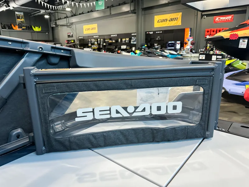 Slide: The Image of 2025 Sea-Doo Switch Sport 18 in showroom, featuring branded panel and modern design. - 10