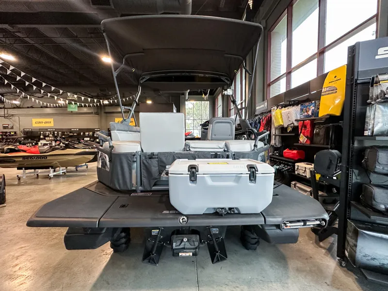 Slide: The Image of 2025 Sea-Doo Switch Sport 18 in showroom, featuring spacious deck and storage. - 11