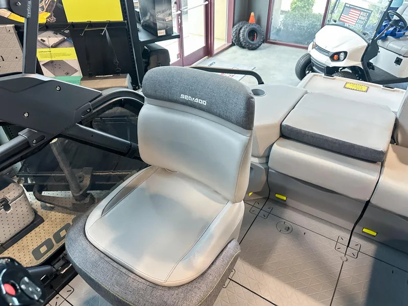 Slide: The Image of 2025 Sea-Doo Switch Sport 18 interior with gray seating and modern design. - 6