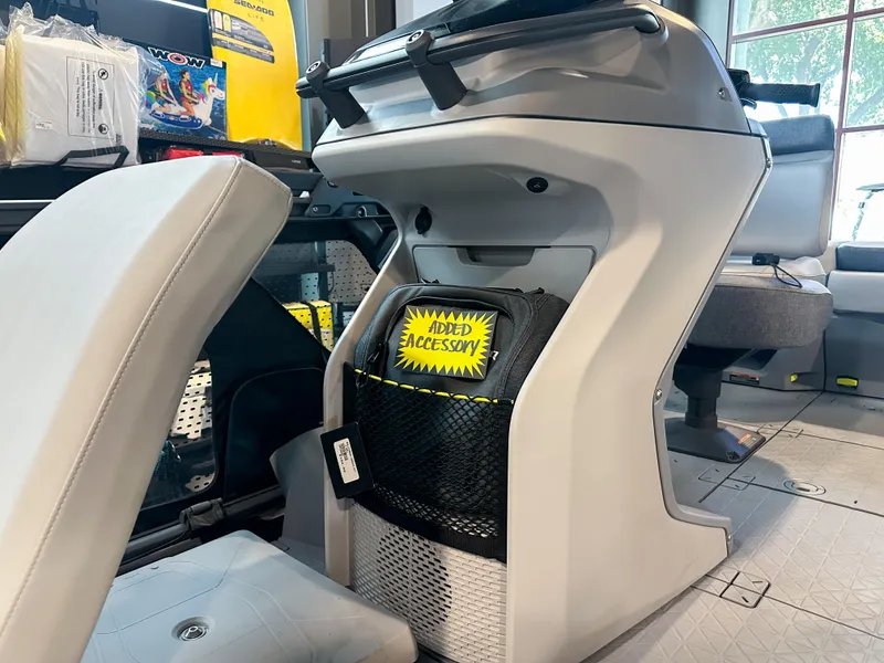 Slide: The Image of 2025 Sea-Doo Switch Sport 18 interior with storage compartment and accessory display. - 9