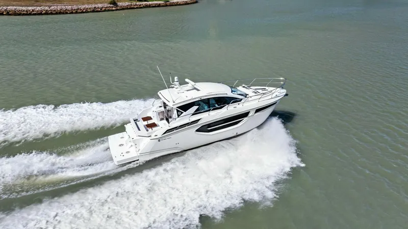 Slide: The Image of 2023 Cruisers Yachts 42 Cantius cruising on open water, aerial view. - 42