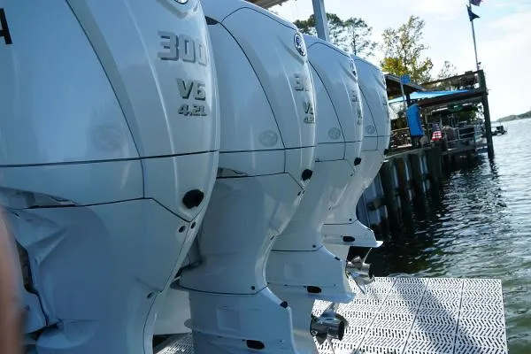 Slide: The Image of Four powerful outboard motors on a docked Everglades 435CC boat, 2016 model. - 24