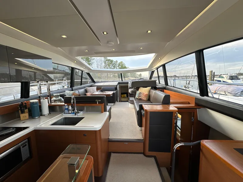 Slide: The Image of Luxurious interior of a 2015 Prestige 500 S yacht with modern amenities and panoramic windows. - 2