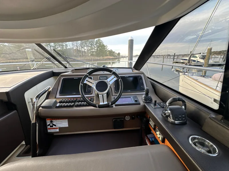Slide: The Image of Cockpit of 2015 Prestige 500 S yacht with steering wheel and navigation controls. - 20