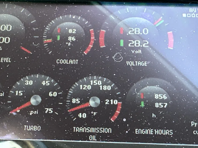 Slide: The Image of Dashboard gauges of a 2015 Prestige 500 S, showing coolant, voltage, turbo, and engine hours. - 23