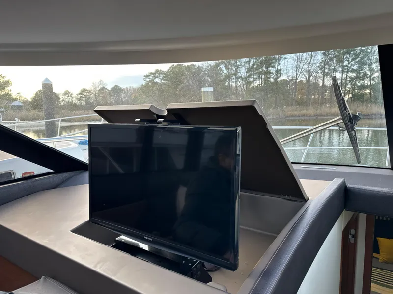Slide: The Image of Interior of 2015 Prestige 500 S yacht with a mounted TV screen. - 24