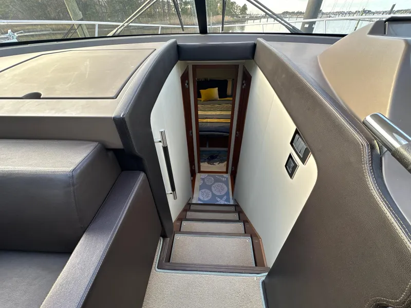 Slide: The Image of Interior view of 2015 Prestige 500 S yacht, showing stairs leading to lower cabin. - 25