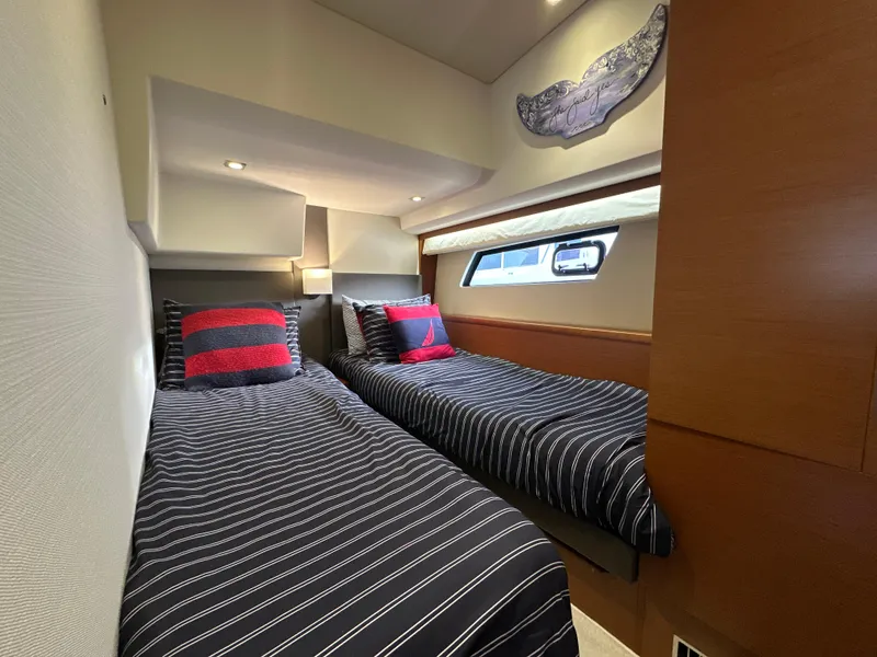 Slide: The Image of Twin cabin with striped bedding in 2015 Prestige 500 S yacht interior. - 31
