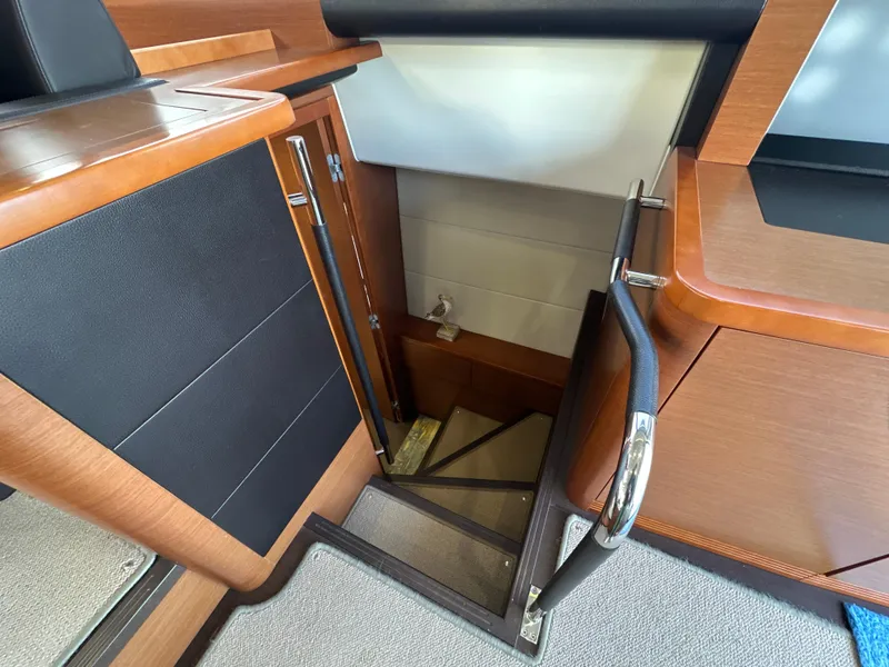 Slide: The Image of Staircase leading below deck on 2015 Prestige 500 S yacht interior. - 34