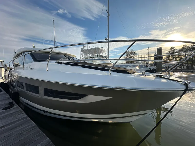 Slide: The Image of Prestige 500 S yacht, 2015 model, docked at marina under a clear sky. - 4