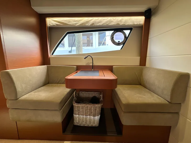 Slide: The Image of Interior of 2015 Prestige 500 S yacht with cozy seating and window view. - 40