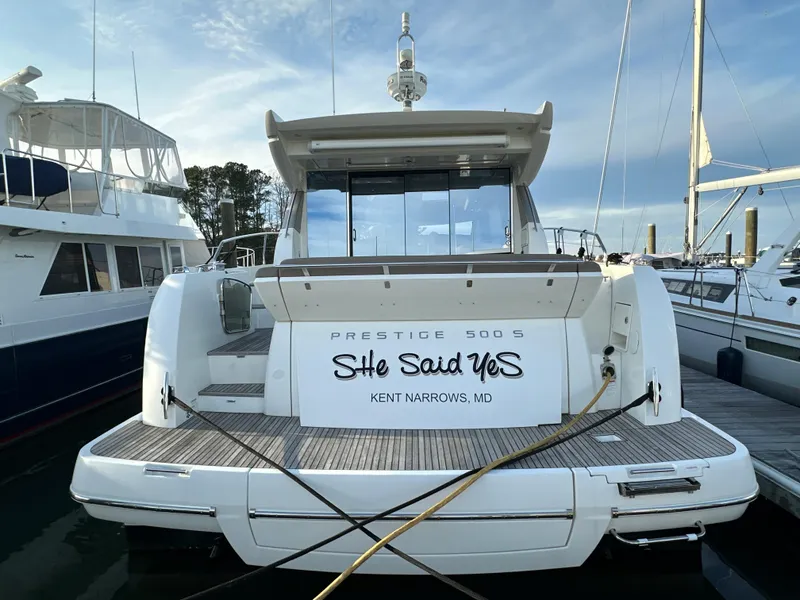 Slide: The Image of 2015 Prestige 500 S yacht docked, named "She Said Yes," at Kent Narrows, MD. - 5