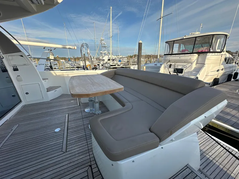 Slide: The Image of Prestige 500 S 2015 yacht deck with seating and table, docked at marina. - 8