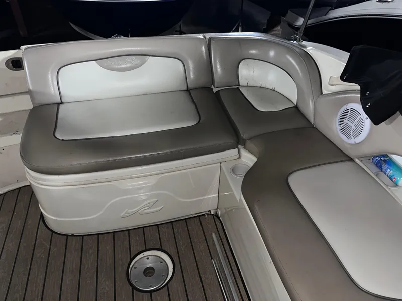 Slide: The Image of 2002 Sea Ray 270 Sundeck interior seating with gray and white upholstery. - 5
