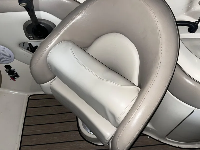 Slide: The Image of 2002 Sea Ray 270 Sundeck boat seat, beige and white upholstery, close-up view. - 8