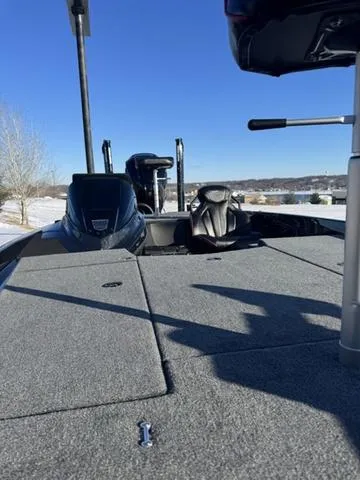 Slide: The Image of 2025 Skeeter ZXR20 boat deck with seating, under clear blue sky. - 3