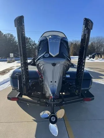 Slide: The Image of 2025 Skeeter ZXR20 boat with powerful outboard motor, parked on sunny day. - 5