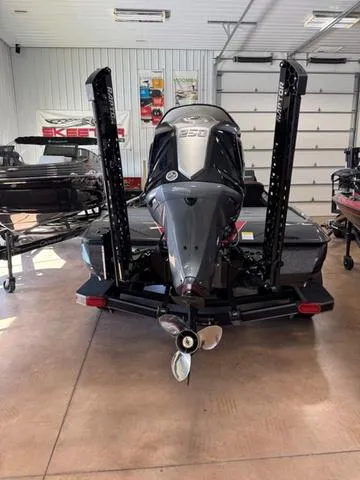 Slide: The Image of Close-up of a 2025 Skeeter ZXR20 boat's trolling motor in a garage setting. - 3