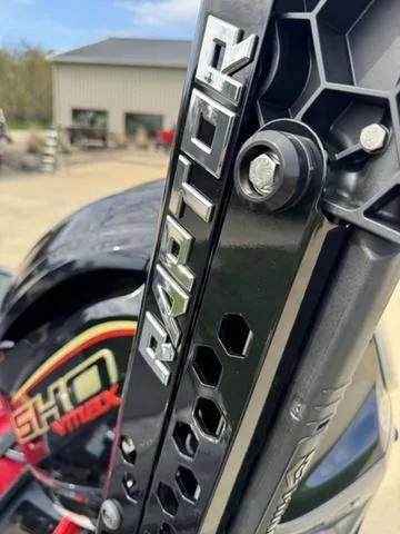 Slide: The Image of 2025 Skeeter ZXR20 boat with red accents on display in showroom. - 4