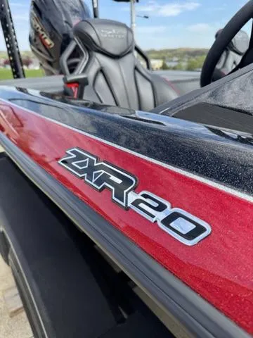 Slide: The Image of 2025 Skeeter ZXR20 boat in showroom, rear view with powerful engine and sleek design. - 6
