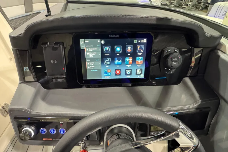 Slide: The Image of 2025 Chaparral 2870 SSX boat interior with sleek seating and modern dashboard design. - 11