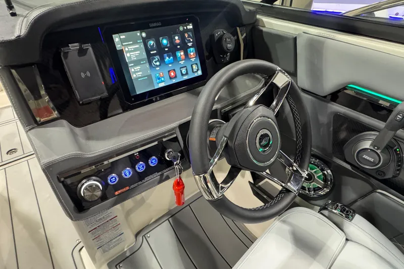 Slide: The Image of 2025 Chaparral 2870 SSX boat interior with modern dashboard and seating. - 12