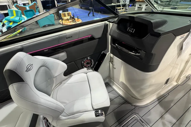 Slide: The Image of Interior of 2025 Chaparral 2870 SSX boat with modern seating and dashboard. - 14