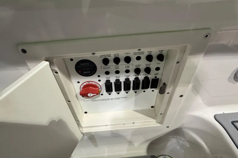 Slide: The Image of 2025 Chaparral 2870 SSX boat deck with seating, speakers, and Munson top dealer award. - 18