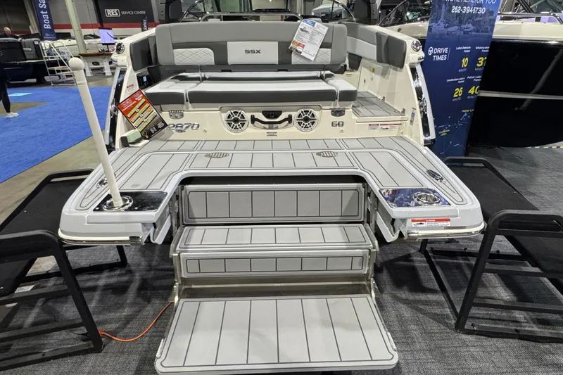 Slide: The Image of 2025 Chaparral 2870 SSX boat on trailer outside Munson Ski & Marine dealership. - 3