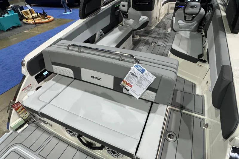 Slide: The Image of 2025 Chaparral 2870 SSX boat interior with gray seating and a round table. - 5