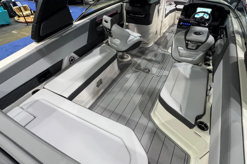 Slide: The Image of 2025 Chaparral 2870 SSX boat interior with gray seating and spacious layout. - 6