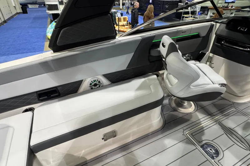 Slide: The Image of 2025 Chaparral 2870 SSX boat interior with sleek seating and modern dashboard. - 7