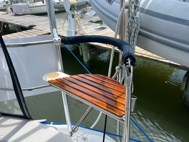 Slide: The Image of Teak swim platform on 1998 Hunter 410 sailboat at marina. - 14