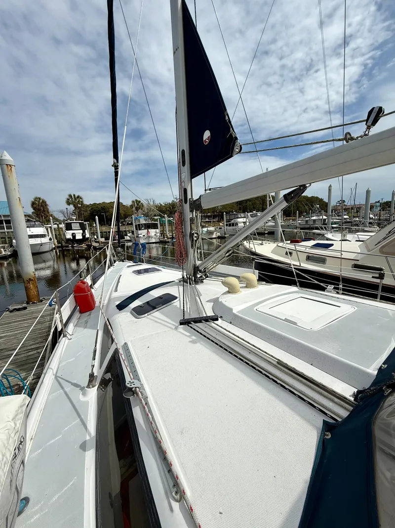 Slide: The Image of Sailboat docked at marina, Hunter 410 model, 1998, with clear sky background. - 21