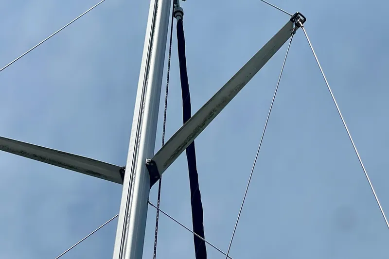 Slide: The Image of Mast and rigging of a 1998 Hunter 410 sailboat against a clear sky. - 24