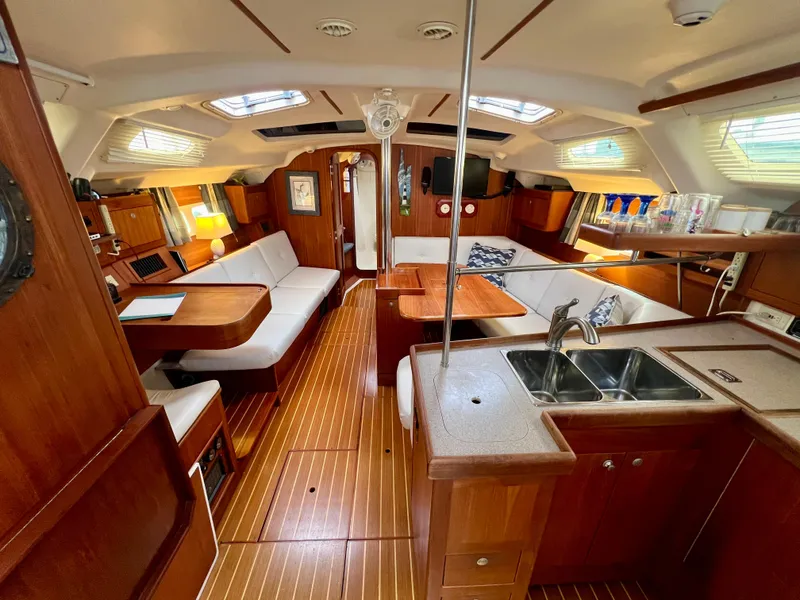 Slide: The Image of Interior of a 1998 Hunter 410 sailboat with wood finish and modern amenities. - 34