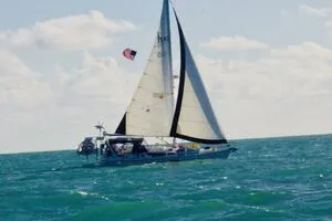 Slide: The Image of Sailboat on open sea, Hunter 410 model, 1998, with American flag. - 46