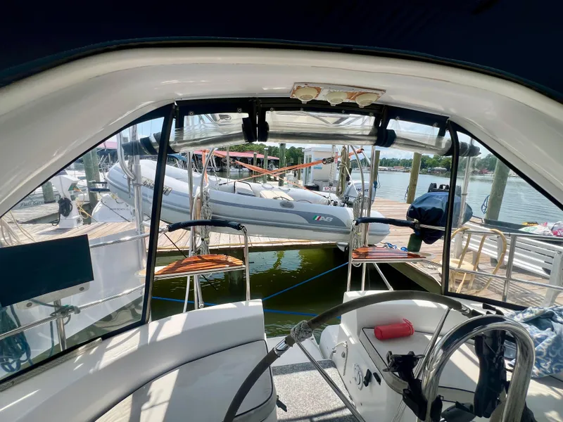 Slide: The Image of Interior view of a 1998 Hunter 410 sailboat docked at a marina. - 5