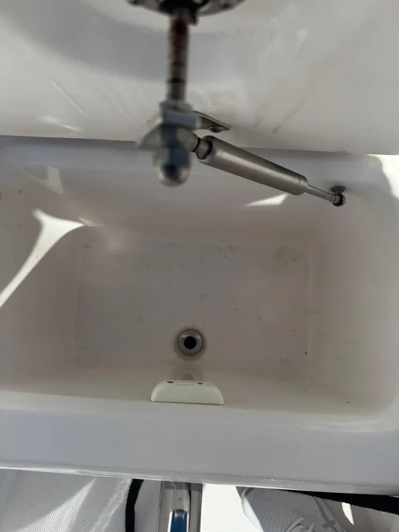 Slide: The Image of Everglades 340 Dual Console 2019 boat compartment interior with hydraulic support. - 27