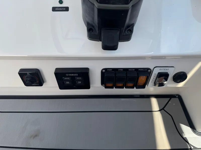 Slide: The Image of Control panel of 2019 Everglades 340 Dual Console boat with switches and dials. - 39