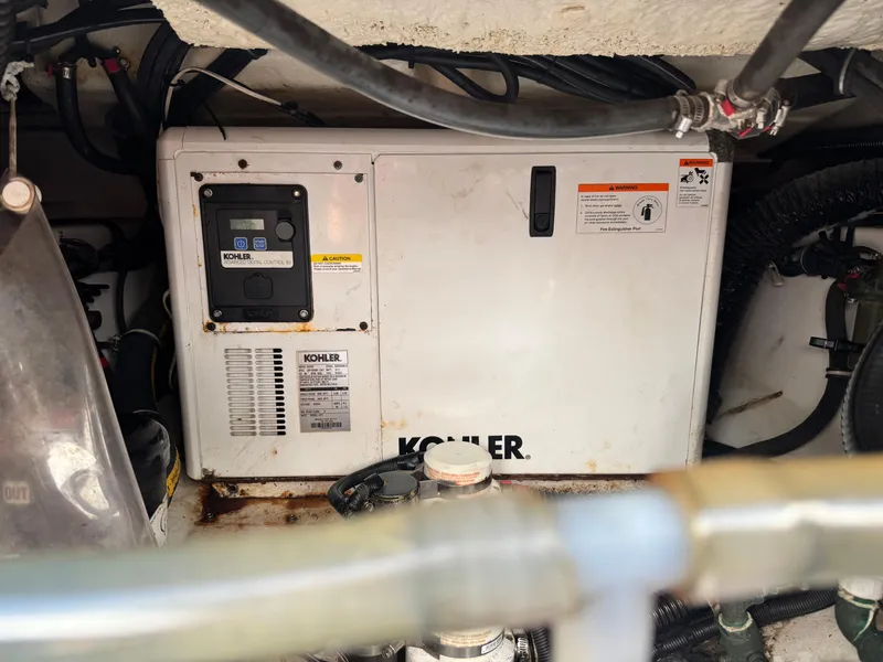 Slide: The Image of Kohler generator in 2019 Everglades 340 Dual Console boat engine compartment. - 43