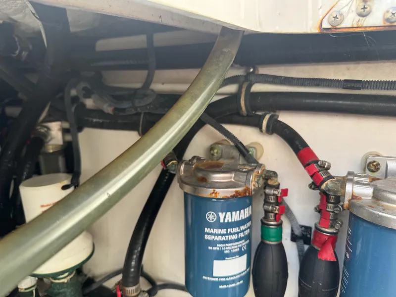 Slide: The Image of Engine compartment of 2019 Everglades 340 Dual Console with Yamaha fuel filters. - 45