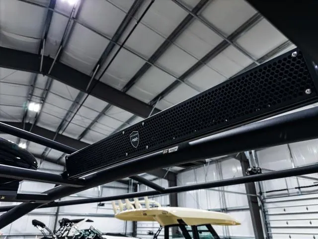Slide: The Image of 2022 Yamaha Boats 255XD sound system detail in a showroom. - 10