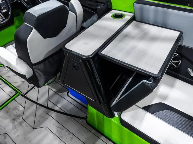 Slide: The Image of 2022 Yamaha Boats 255XD interior with sleek seating and modern table design. - 14
