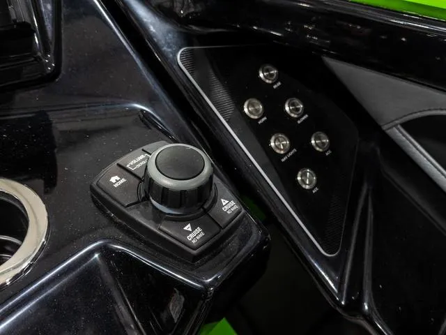 Slide: The Image of Control panel of 2022 Yamaha Boats 255XD with joystick and buttons. - 19