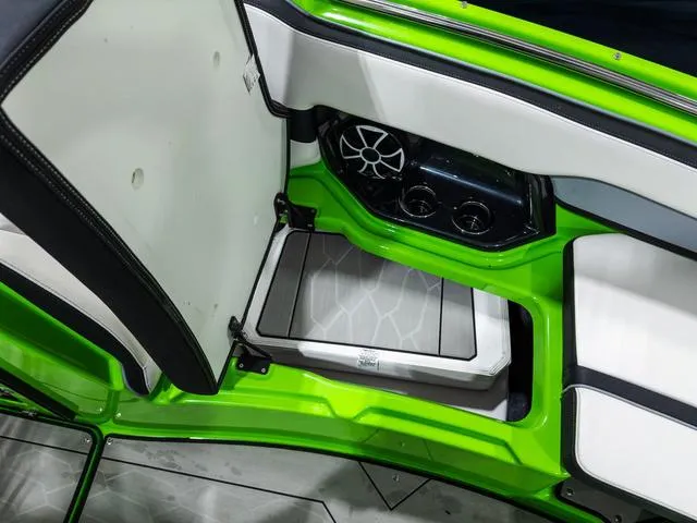 Slide: The Image of 2022 Yamaha Boats 255XD interior with green accents and speaker system. - 22