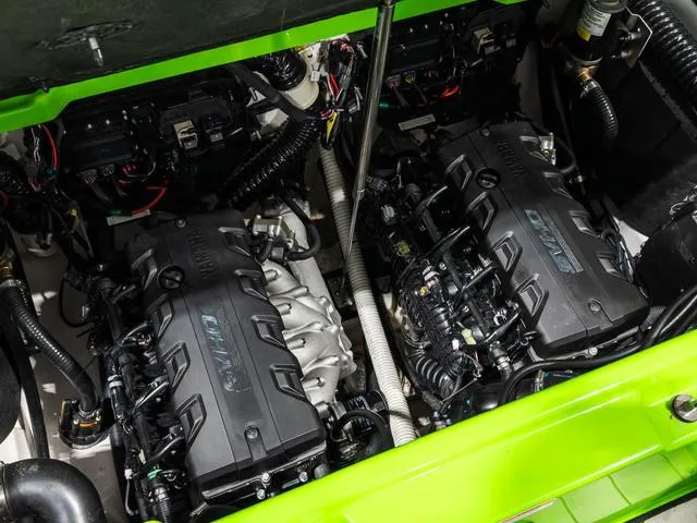 Slide: The Image of 2022 Yamaha Boats 255XD engine compartment with dual engines, showcasing intricate mechanical details. - 29