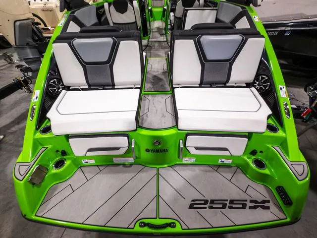 Slide: The Image of 2022 Yamaha Boats 255XD, vibrant green, luxury seating, modern design, rear view. - 5