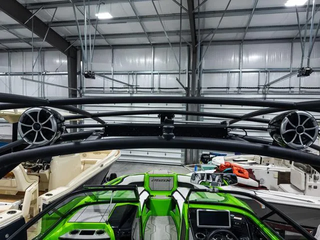 Slide: The Image of 2022 Yamaha Boats 255XD in a showroom, featuring sleek design and advanced audio system. - 9