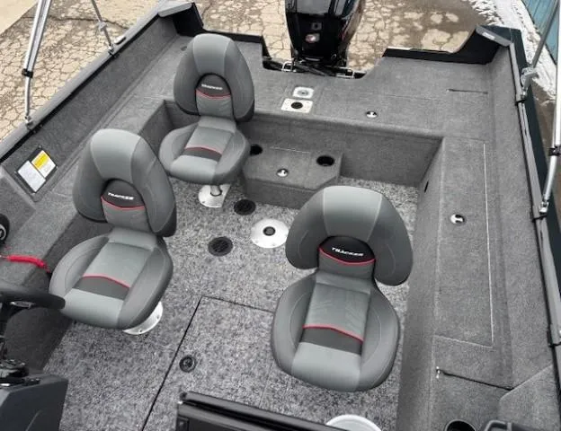 Slide: The Image of 2025 Tracker Pro Guide V-175 WT boat interior with four gray seats and carpeted flooring. - 15